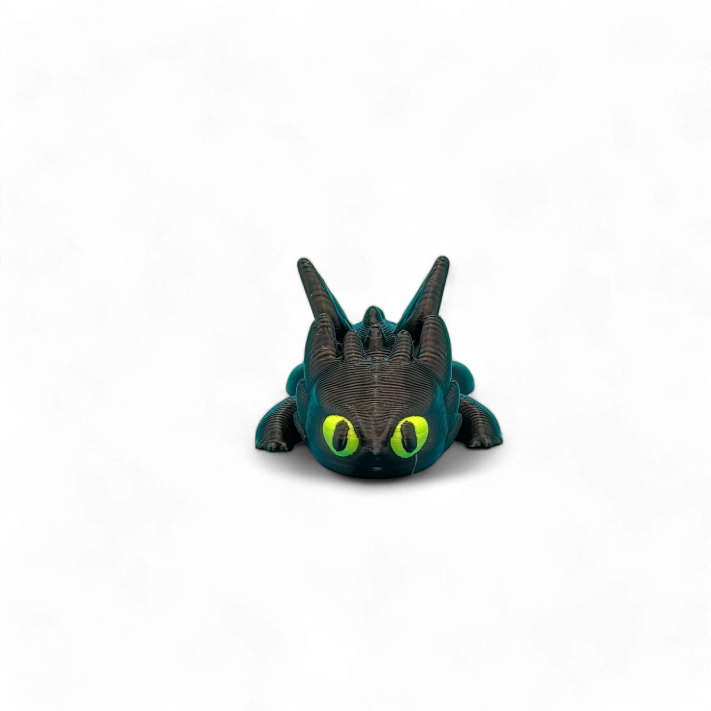 3D-Geprinte toothless flexi sleutelhanger, zwart lichaam met gif groene ogen, voorkant